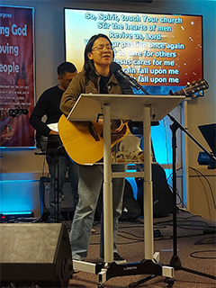 Worship leader singing